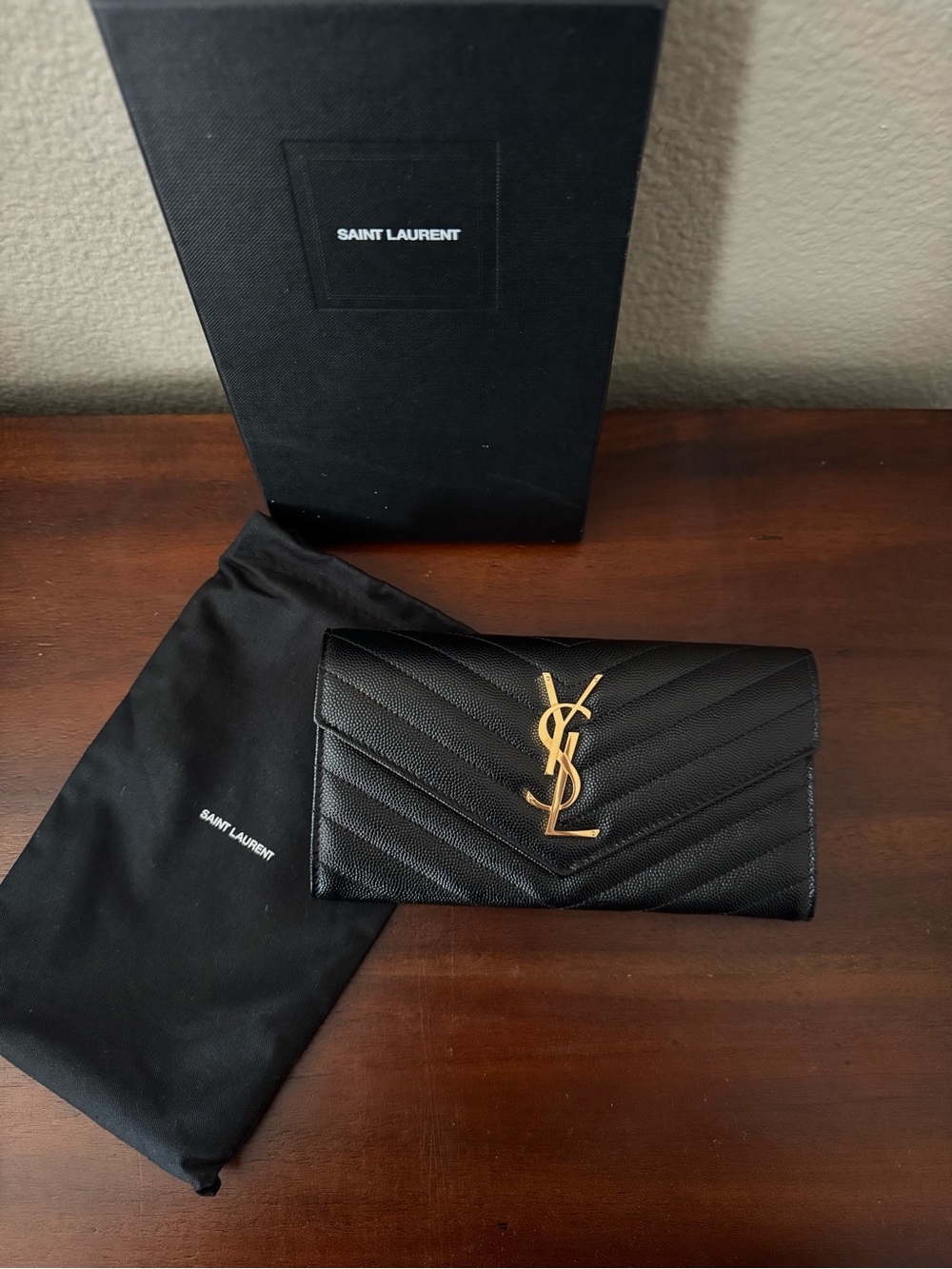 Saint Laurent Cassandre YSL Monogram Large Flap Wallet in grained leather